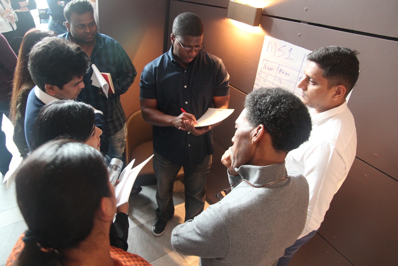 A group of Enstoans discuss during a group exercise at Enstoa Spark 2019